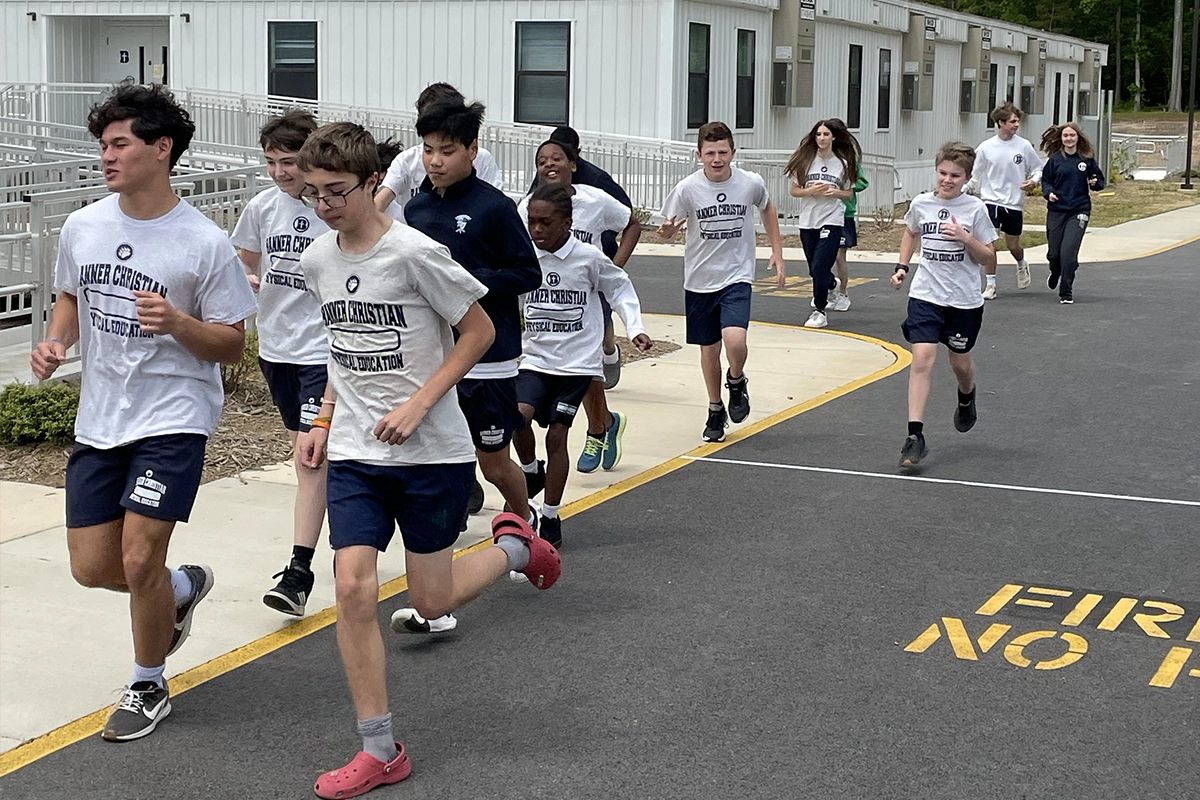 A group of Banner students jogging on campus.