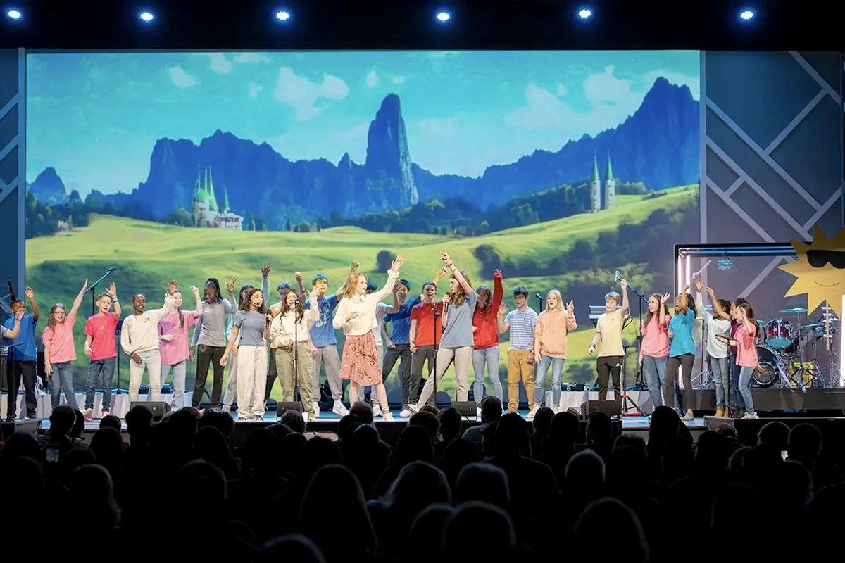 Students on stage during the Embracing Grace program.